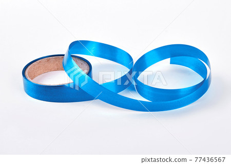Roll of blue ribbon on white background. Roll of blue ribbon on white background. 77436567