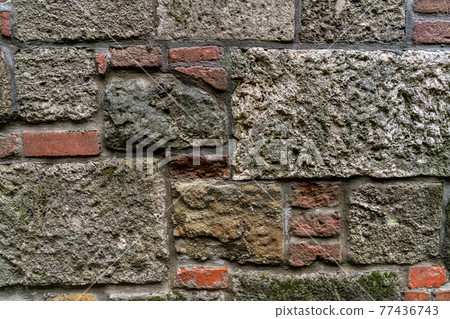 stone wall is solid and smooth from cobblestones old town 77436743