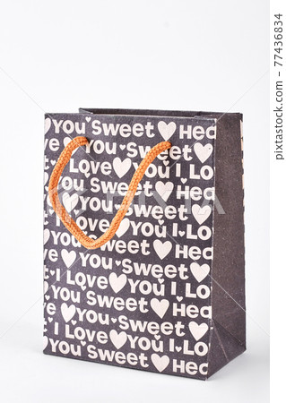 Black paper patterned gift bag. Black paper patterned gift bag. 77436834