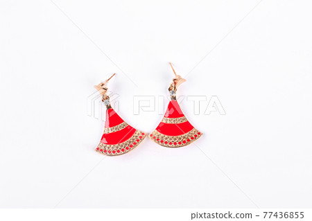 Fashion earrings on white background. Fashion earrings on white background. 77436855