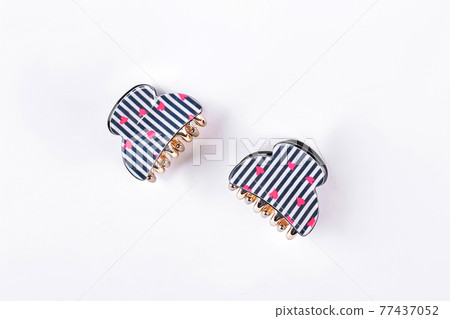 Two stylish hair clips on white background. Two stylish hair clips on white background. 77437052