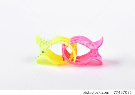 Two colorful hair clips on white background. Two colorful hair clips on white background. 77437055