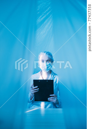 medical record doctor in face mask with clipboard medical record doctor in face mask with clipboard 77437358
