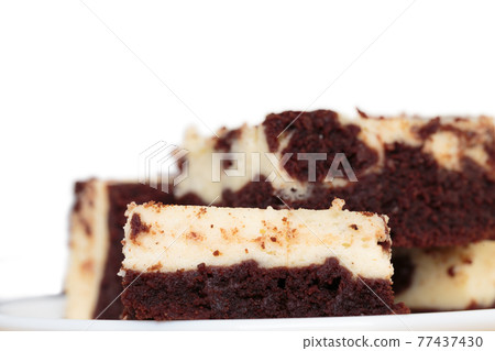 Still life with a slice of cheesecake brownie. Still life with a slice of cheesecake brownie. 77437430