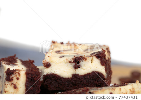 Still life with a slice of cheesecake brownie. Still life with a slice of cheesecake brownie. 77437431