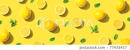 Fresh yellow lemons with mints overhead view Fresh yellow lemons with mints overhead view 77438457