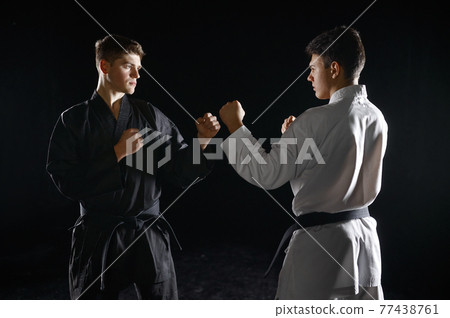 Two male karatekas in kimono, strike Two male karatekas in kimono, strike 77438761