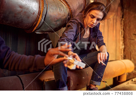 Drug addict man and woman smoking in withdrawal 77438808