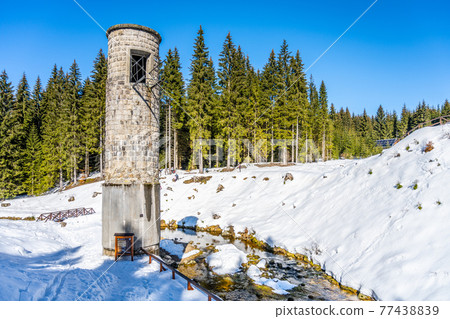 Broken dam in winter mountains Broken dam in winter mountains 77438839
