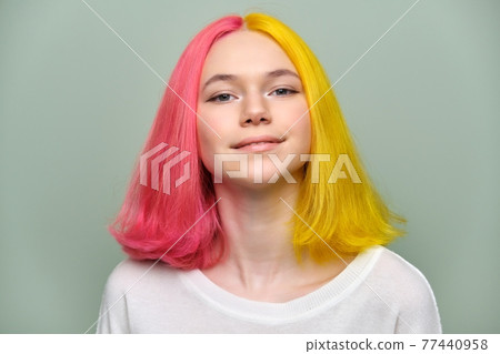 Headshot of fashionable beautiful teen girl with trendy dyed hair Headshot of fashionable beautiful teen girl with trendy dyed hair 77440958