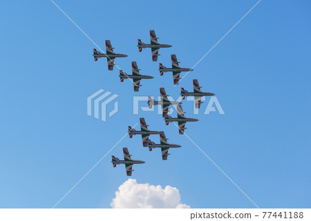 Italian Air Force acrobatics team "Frecce Tricolori" double umbrella formation 77441188