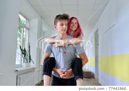 Students teenagers, couple happy laughing male and female having fun together 77442868