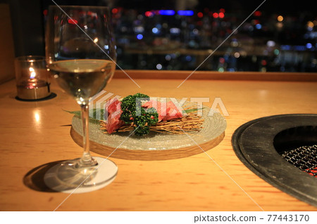 White wine with the night city view of tokyo 77443170