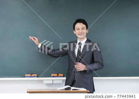 Male teacher looking at the camera 77443941