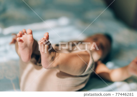 Child adoption and In Vitro Fertilization IVF . Asian child lying on the bed. Caring for newborn children Child adoption and In Vitro Fertilization IVF . Asian child lying on the bed. Caring for newborn children 77446281