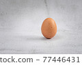 Close-up view of raw chicken eggs on wooden background. Eggs are often said to be the original superfood because of their many health benefits. 77446431