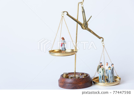 Image of gender balance between men and women on the balance Image of gender balance between men and women on the balance 77447598