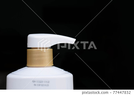 Manufacturing date and expiry date on bottle surface 77447832