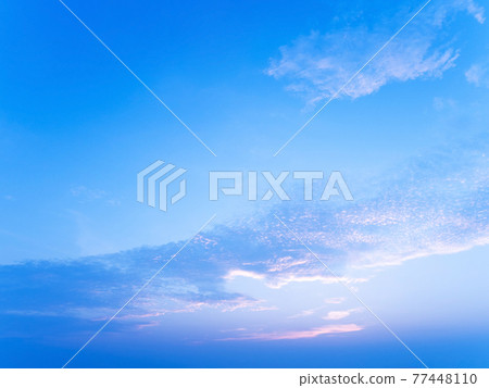 Peaceful blue sunset sky or sunrise sky, tropical island view at dawn or dusk Peaceful blue sunset sky or sunrise sky, tropical island view at dawn or dusk 77448110