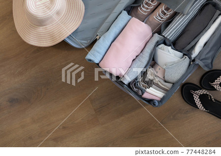 Top view suitcase baggage packing organization use konmari method frame empty space trip vacation 77448284