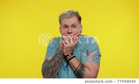 Scared fearful depressed man expresses his fear and waves his hands away from danger, waving no 77449040