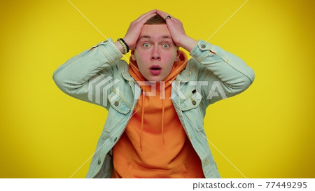 Excited amazed man surprise looking at camera with big eyes, shocked by sudden victory, wow emotion Excited amazed man surprise looking at camera with big eyes, shocked by sudden victory, wow emotion 77449295