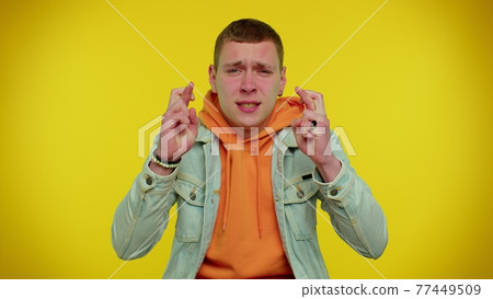 Man wish for good luck and becoming surprised about sudden dream come true, waiting lottery winning Man wish for good luck and becoming surprised about sudden dream come true, waiting lottery winning 77449509
