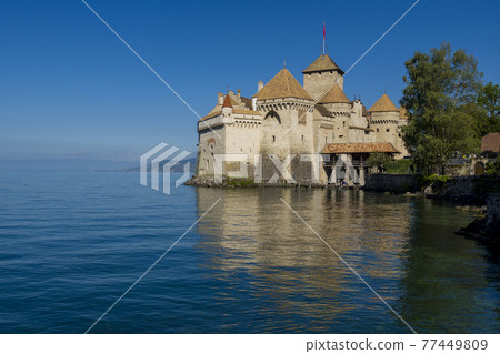 panoramic view of historic Chateau de Chillon at Lake Geneva in summer, Canton of Vaud, Switzerland 77449809