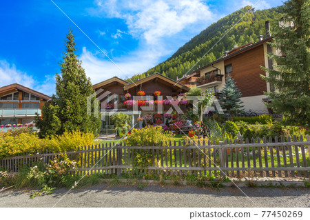 Houses in Zermatt alpine village, Switzerland, summer 77450269