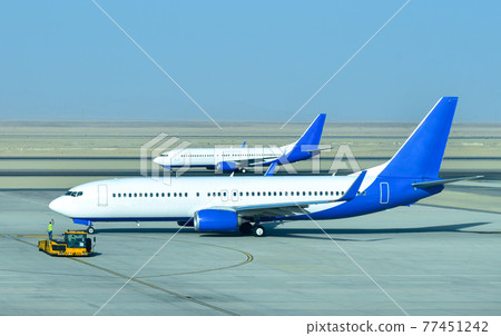 Aircraft on the runway preparing to take off 77451242