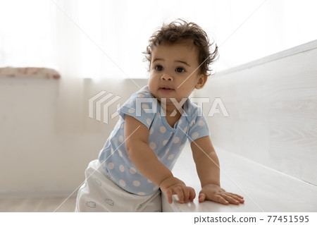 Cute little African American baby child play at home Cute little African American baby child play at home 77451595