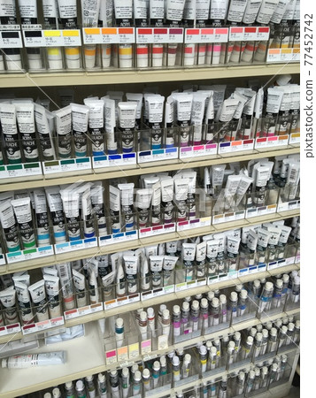 Acrylic paints lined up in the art supplies department 77452742