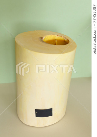 Wooden candle holder rustic interior centerpiece with candles in a cozy barn setting. Wooden candle holder rustic interior centerpiece with candles in a cozy barn setting. 77453387