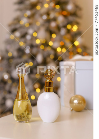 Generic perfume bottles in a gift set on christmas background Generic perfume bottles in a gift set on christmas background 77453468