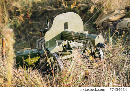 Maxim's Machine Gun Model 1910/30 On A Wheeled Vladimirov's Mount In Grass Maxim's Machine Gun Model 1910/30 On A Wheeled Vladimirov's Mount In Grass 77454684