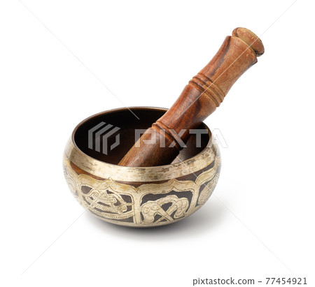copper singing bowl and wooden mallet isolated on white background. Musical instrument for meditation, relaxation copper singing bowl and wooden mallet isolated on white background. Musical instrument for meditation, relaxation 77454921