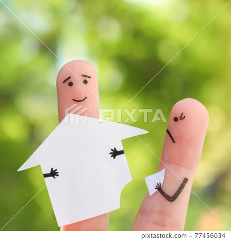 Fingers art of family during quarrel. Concept of man and woman divide house after divorce. 77456034