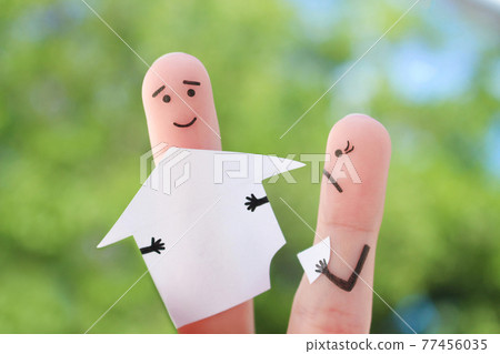 Fingers art of family during quarrel. Concept of man and woman divide house after divorce. Fingers art of family during quarrel. Concept of man and woman divide house after divorce. 77456035