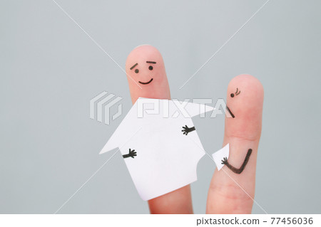 Fingers art of family during quarrel. Concept of man and woman divide house after divorce. Fingers art of family during quarrel. Concept of man and woman divide house after divorce. 77456036