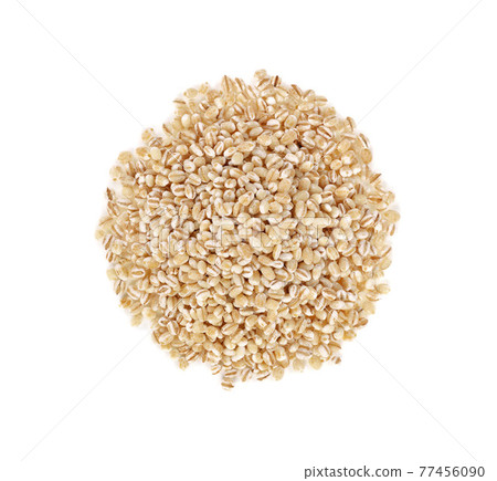 pile of pearl barley isolated on white background. 77456090