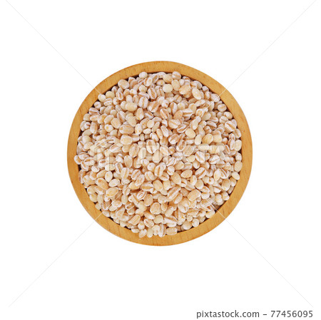pile of pearl barley isolated on white background. 77456095