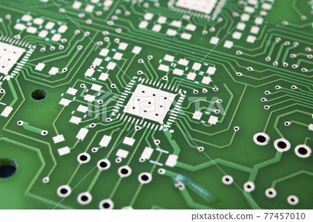 Tracks on the green PCB close up 77457010