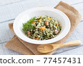 Pilaf with carrot leaves to boost immunity 77457431