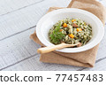 Pilaf with carrot leaves to boost immunity 77457483