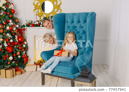 Beautiful young happy and cheerful family on an 77457941