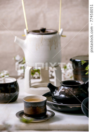White and black handmade ceramic teapot for tea ceremony White and black handmade ceramic teapot for tea ceremony 77458051