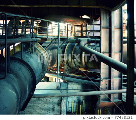 Old rusty piping in the factory 77458121