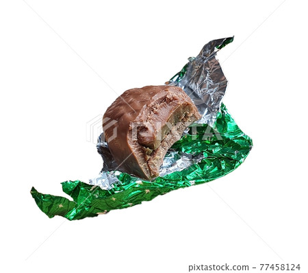 Chocolate truffle unwrapped from a foil Chocolate truffle unwrapped from a foil 77458124