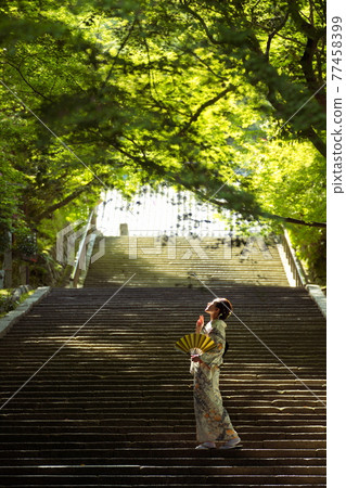 Kimono girls strolling around Arashiyama Horinji Temple in the fresh green Kimono girls strolling around Arashiyama Horinji Temple in the fresh green 77458399