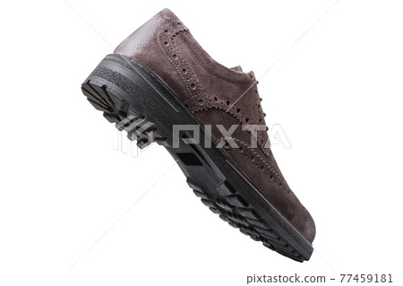brown fashionable men's suede shoe, levitates, as if walking, on a white background brown fashionable men's suede shoe, levitates, as if walking, on a white background 77459181